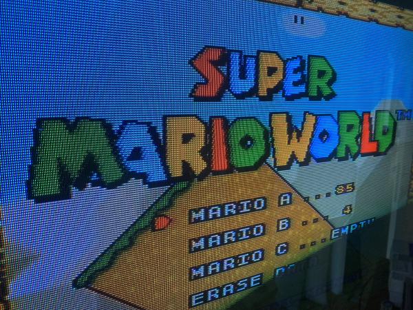 Super Mario World title over composite